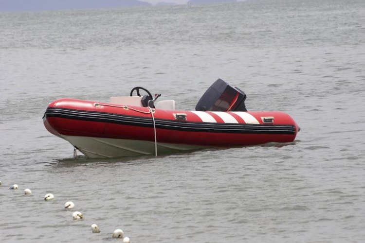 lucato/iStock/Getty Images An rigid inflatable with an outboard motor.