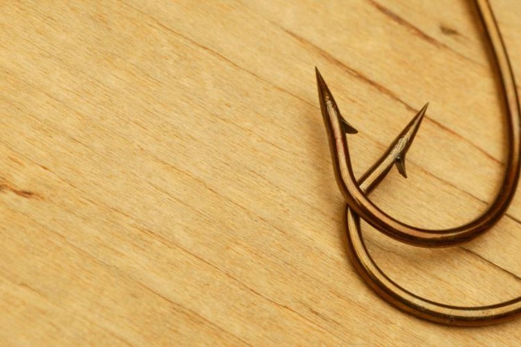 Design Pics/Design Pics/Getty Images A close up view of two fishing hooks.