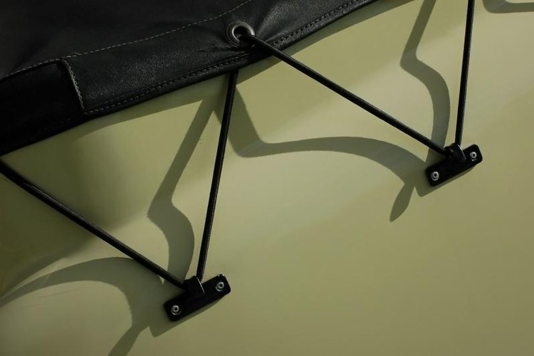 bowerbird/iStock/Getty Images The grommets of tarps allow you to tie them securely in place.