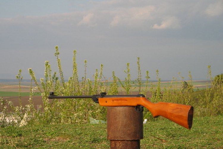 gun image by Dragomir Uzunov from Fotolia.com Adjust your rifle sights to improve your results.