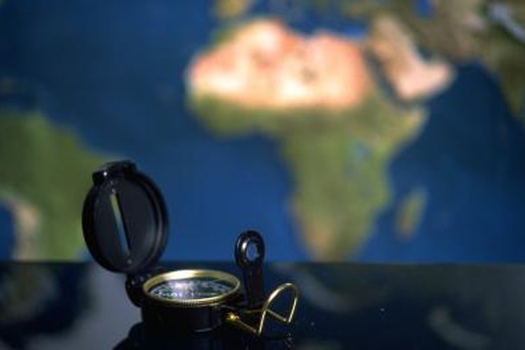 Photos.com/Photos.com/Getty Images A lensatic compass can be used to determine your position.