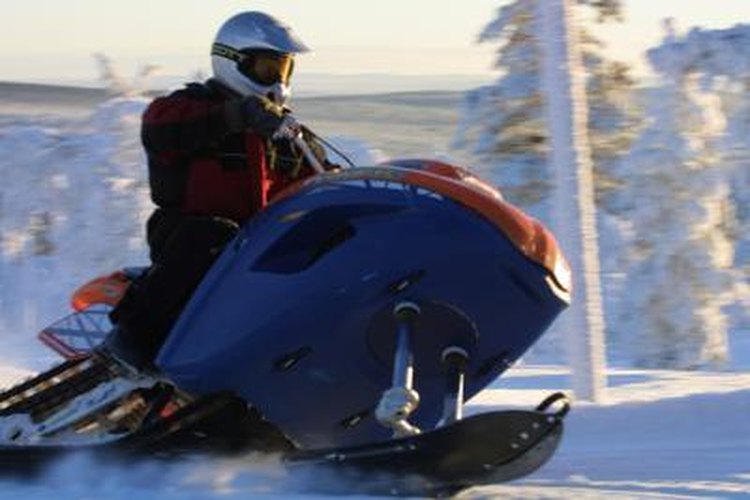 Photos.com/Photos.com/Getty Images The carburetors on the Polaris XLT snowmobile can be removed for cleaning or rebuilding.