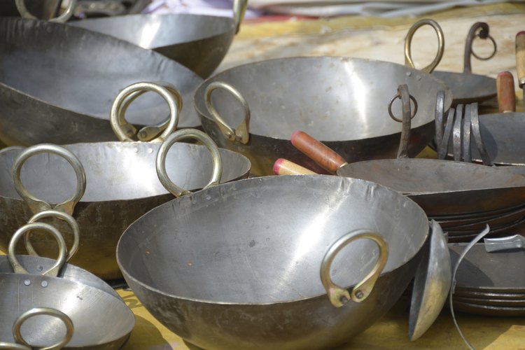 Woks de acero inoxidable.