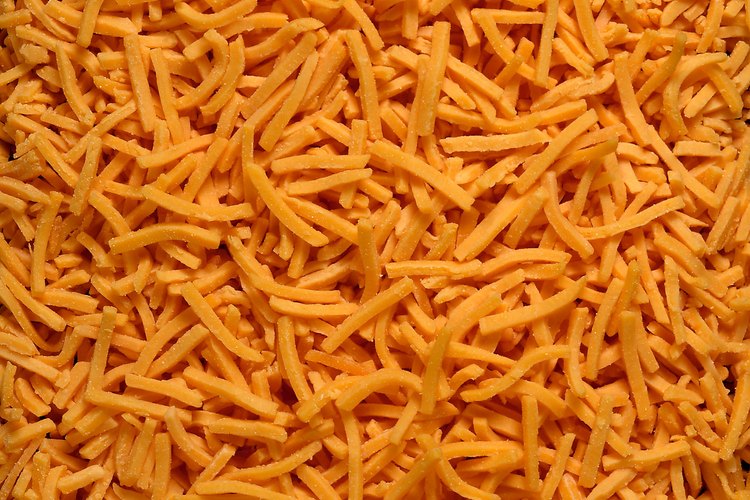 El queso rallado realza las comidas.