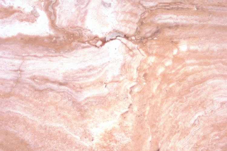 Utiliza un pegamento especial para rocas de una tienda de hardware para pegar el mármol.