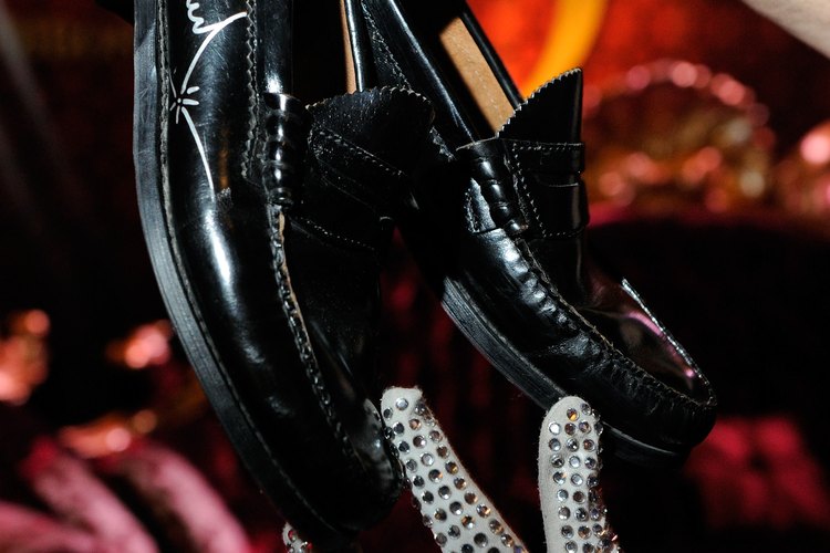 Michael Jackson's famous outfits often included black loafers and sequined gloves.