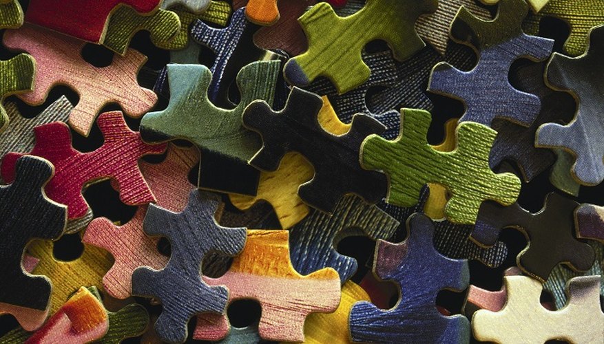 Preserve jigsaw puzzles by sticking them together with glue.