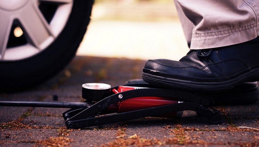 Fix a flat tyre with a foot pump.