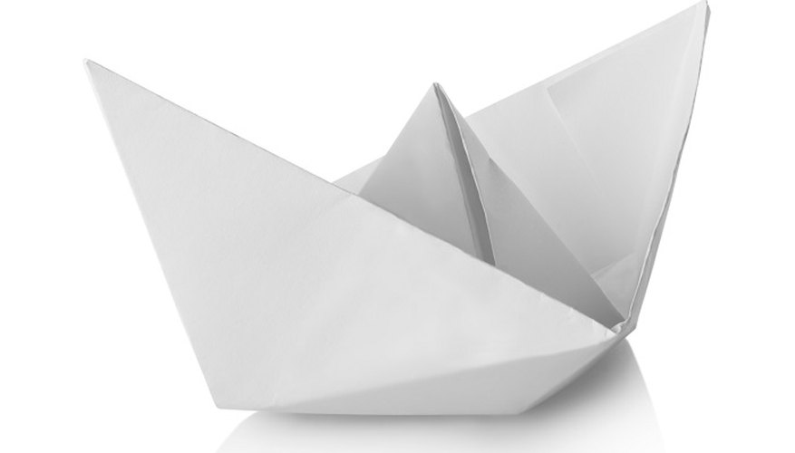 Fold paper into a hat shape.