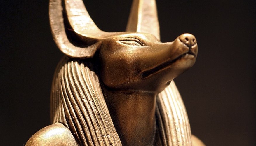 Create a mask resembling the jackal-headed Egyptian god Anubis.
