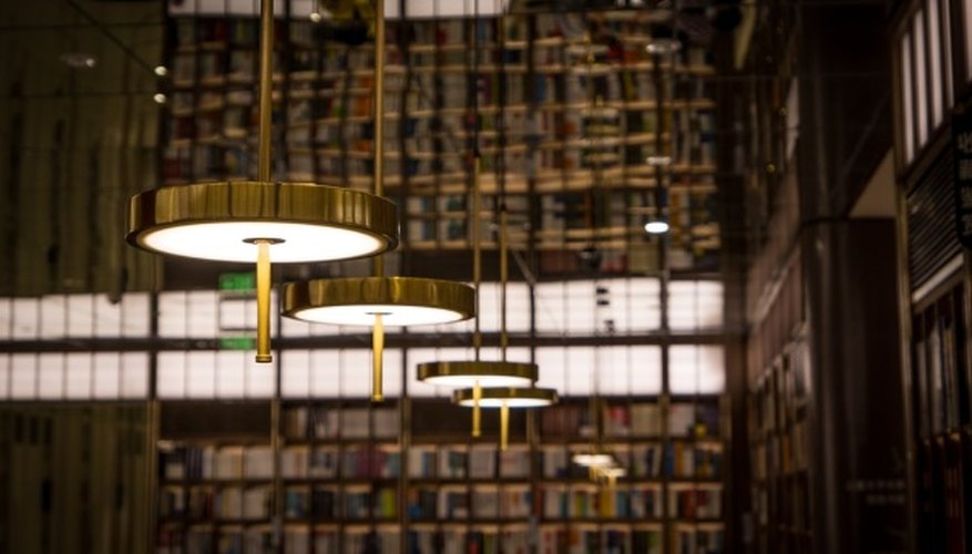 White pendant lamp turned on inside library.jpg