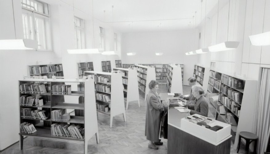 Grayscale photography of people inside book store.jpg