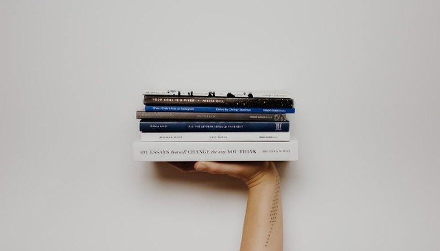 Person holding pile of books.jpg
