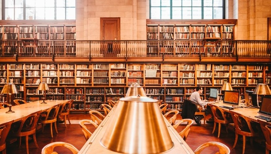Man sitting on chair inside library.jpg