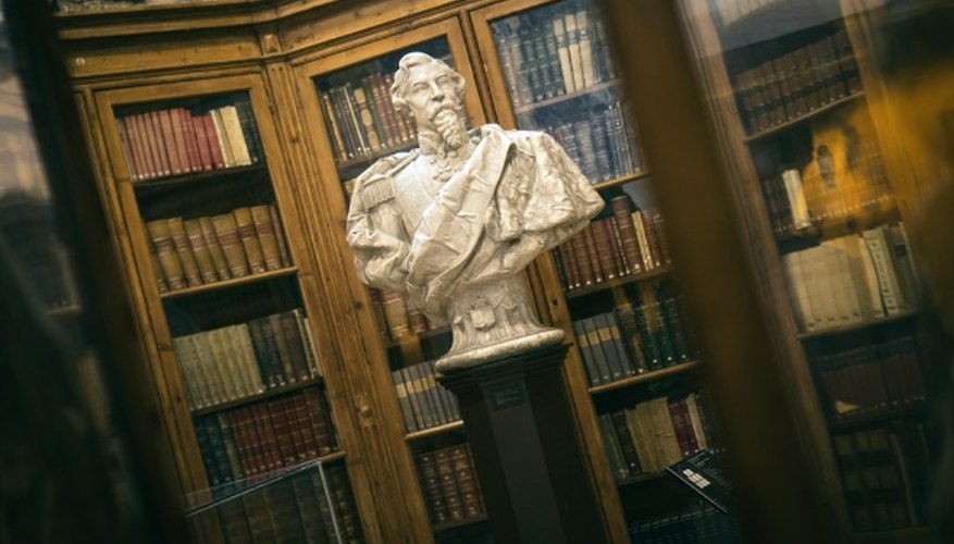 Soldier man statue near different books in shelf.jpg