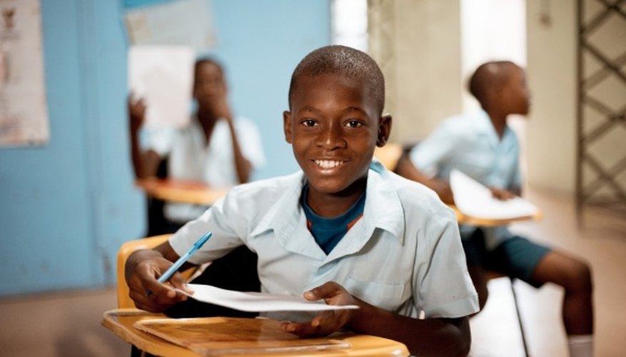 Boy holding white paper.jpg