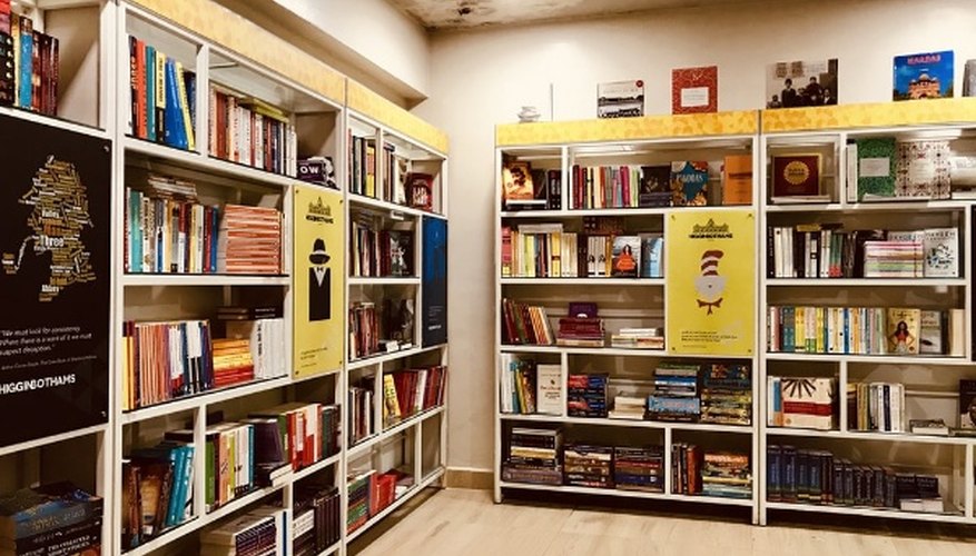 Books on brown wooden shelves.jpg