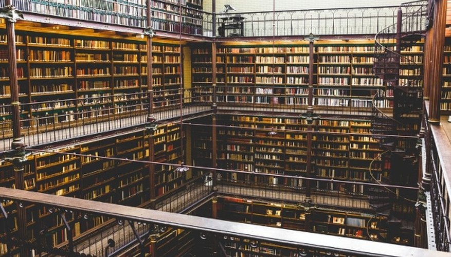 Brown wooden bookshelves and book lot.jpg