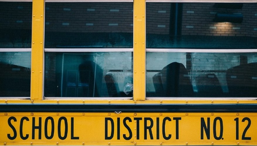 Yellow school bus in front of building.jpg