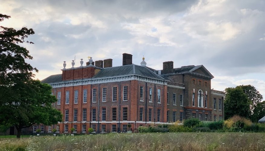Red brick house under cloudy sky at daytime.jpg