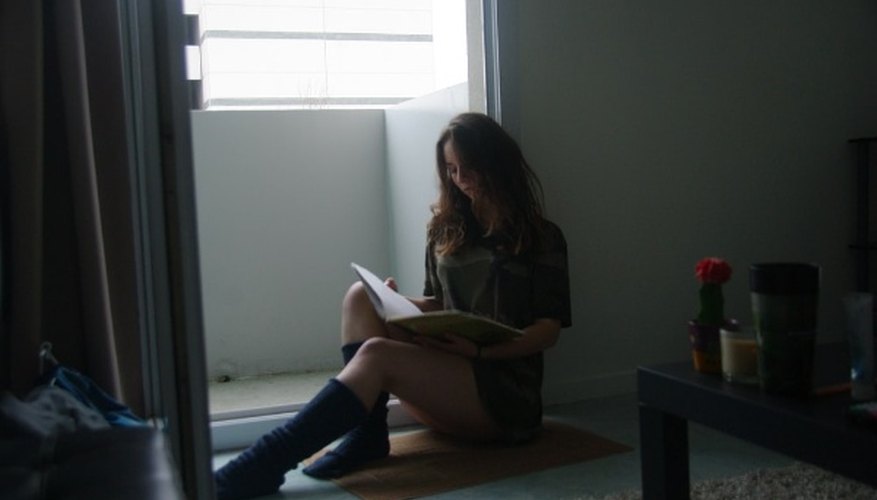 Sitting woman leaning on an open door.jpg