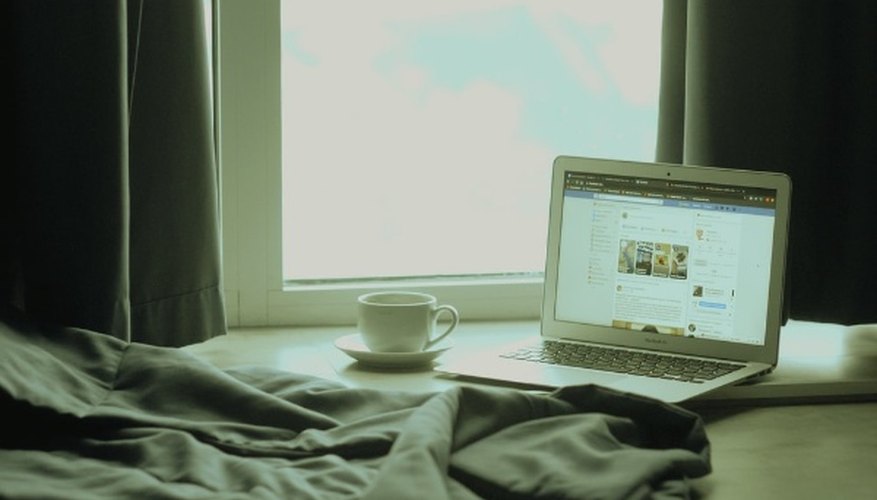 White laptop computer on bed.jpg