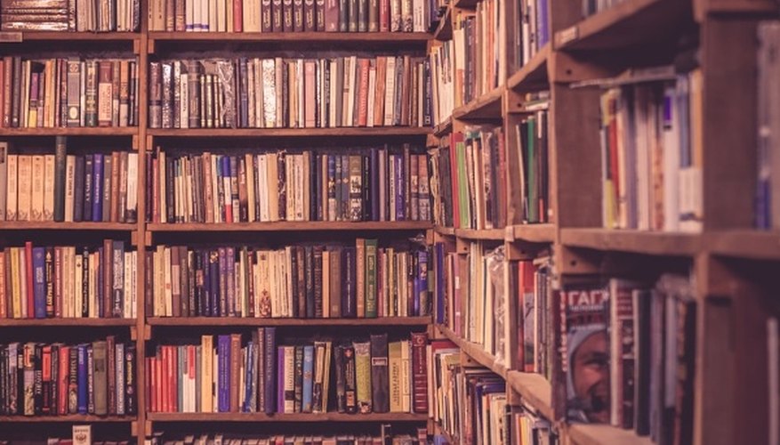 Brown wooden bookcases filled with books.jpg