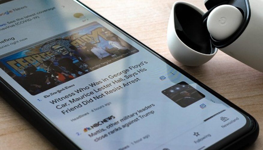 Black iphone 7 on brown wooden table.jpg