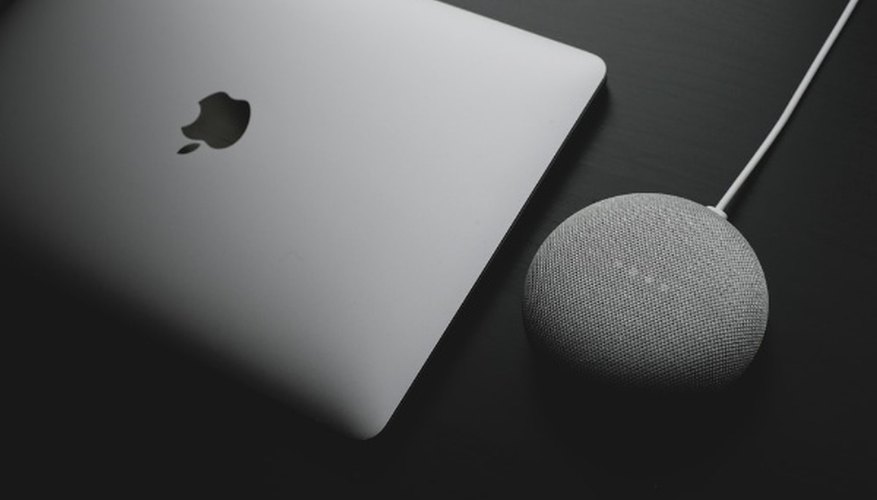 Silver macbook on black table.jpg