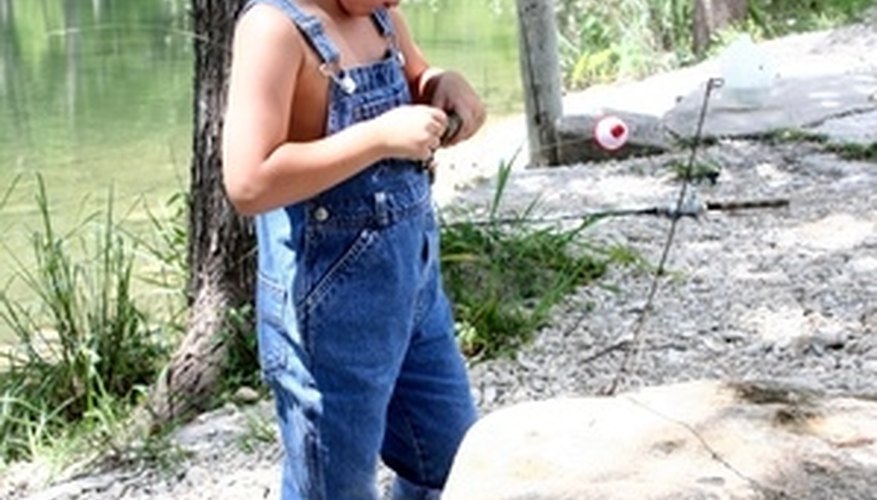 Photo Credit: fishing toddler image by stagewestphoto from <a href='http://www.fotolia.com'>Fotolia.com</a> Fishing is a popular pastime for the family.