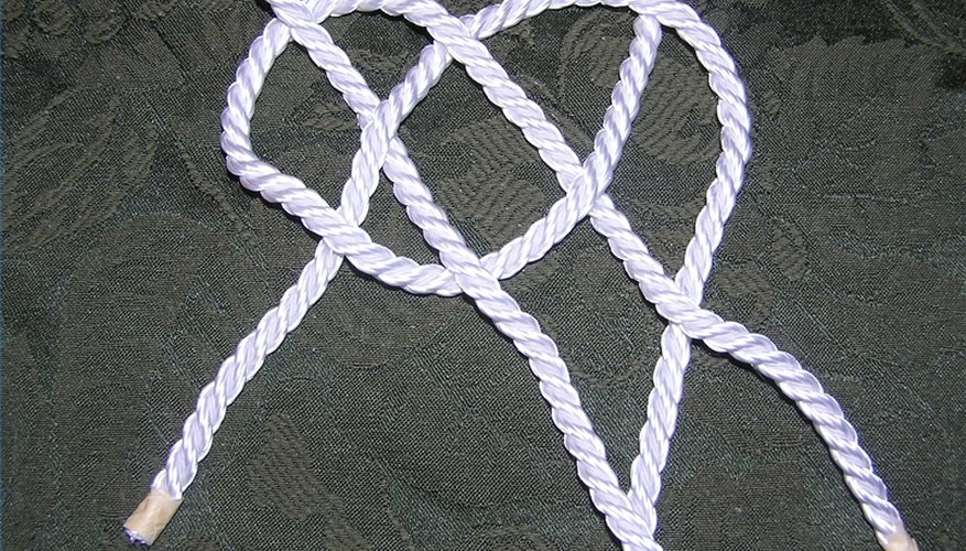 Left hand rope threaded through loop on right hand rope