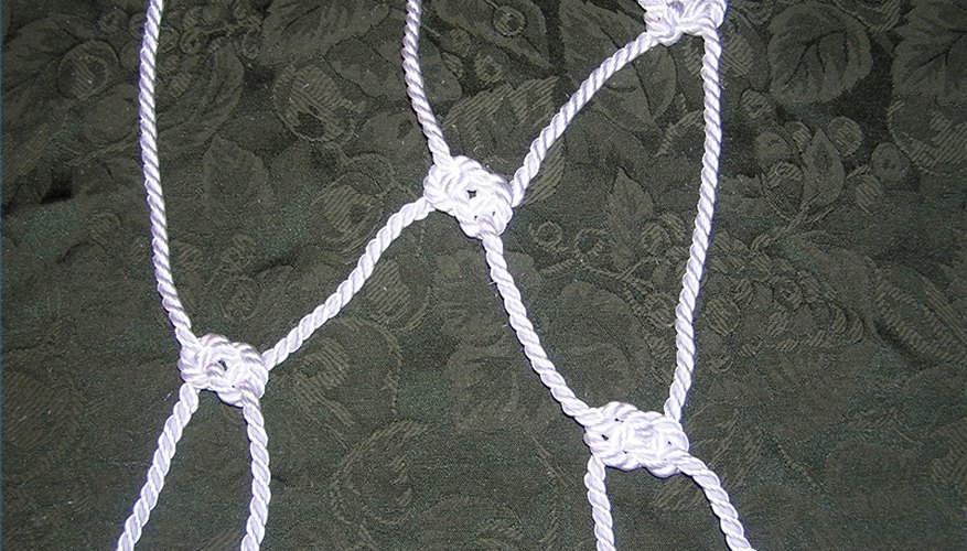Working the end ropes back into the net