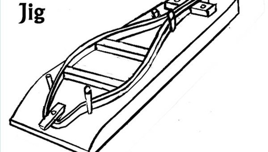 Simple wooden frame jig. Extra dowels or tie-downs can be added as needed.
