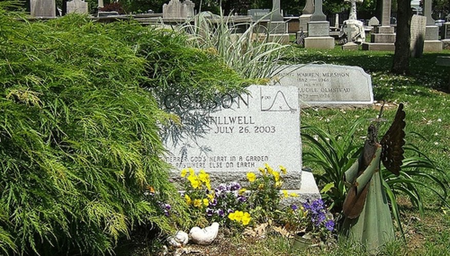 This mathematicians headstone features a bell curve in the upper right hand corner.