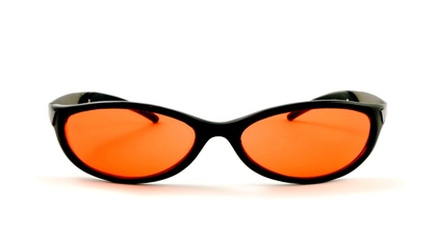 Photo Credit: orange sunglasses image by Karin Lau from <a href='http://www.fotolia.com'>Fotolia.com</a> Amber lenses provide good contrast.