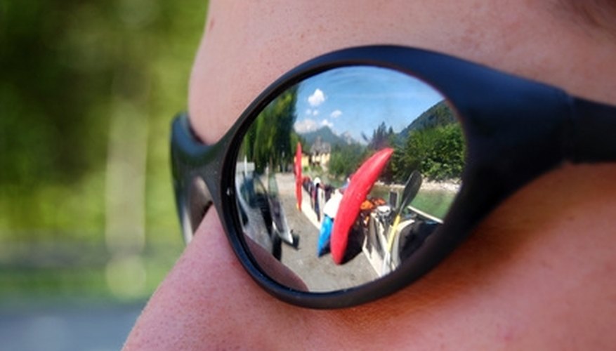 Photo Credit: world in your glasses image by Ubi17 from <a href='http://www.fotolia.com'>Fotolia.com</a> Mirrored sunglasses.