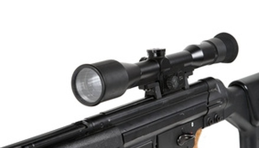 Photo Credit: sniper rifle on the tripod and optical sight image by Vladimir Melnik from <a href=