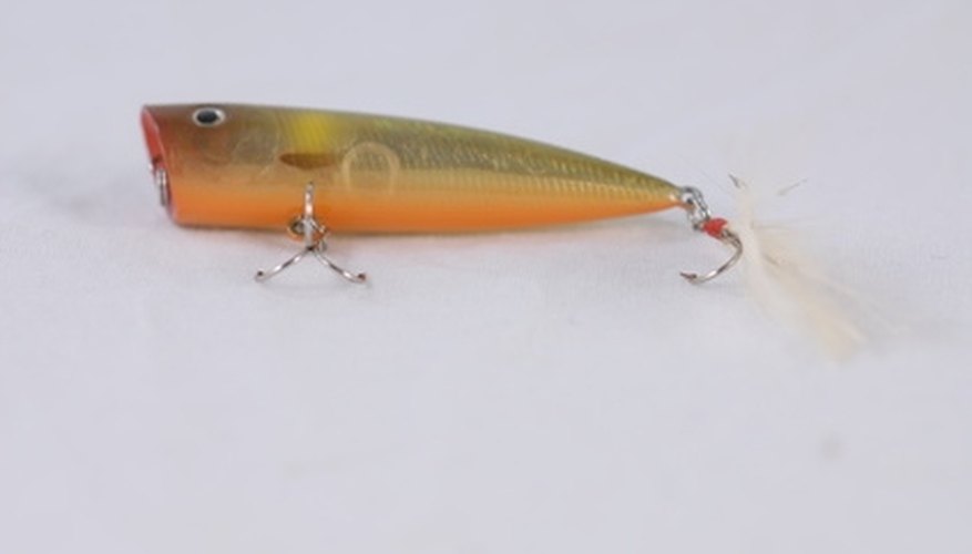 Photo Credit: fishing lure image by jimcox40 from <a href='http://www.fotolia.com'>Fotolia.com</a> A topwater lure with a slanted head.