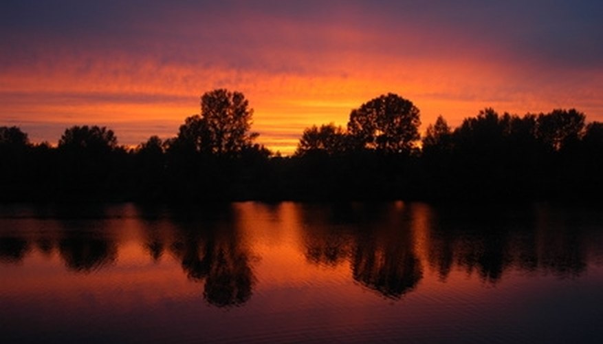 Photo Credit: dusk image by Sergey Dyadechkin from <a href='http://www.fotolia.com'>Fotolia.com</a> Dawn and dusk are the best times for catching crappie.
