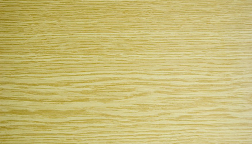 Photo Credit: wood texture image by PaulPaladin from <a href='http://www.fotolia.com'>Fotolia.com</a> Stain unfinished wood.