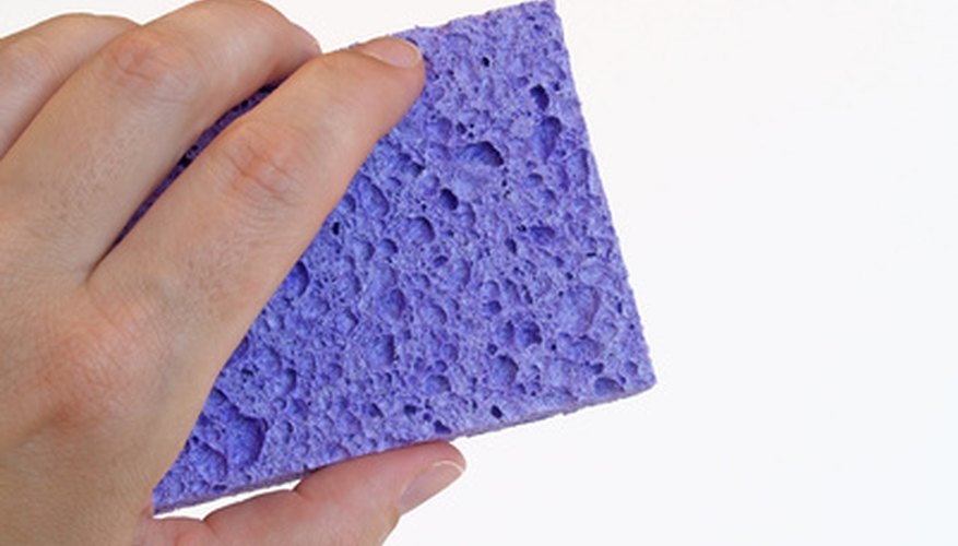 Photo Credit: hand with sponge image by sparkia from <a href='http://www.fotolia.com'>Fotolia.com</a> Present your RV to prospective buyers after thoroughly cleaning and restoring it.