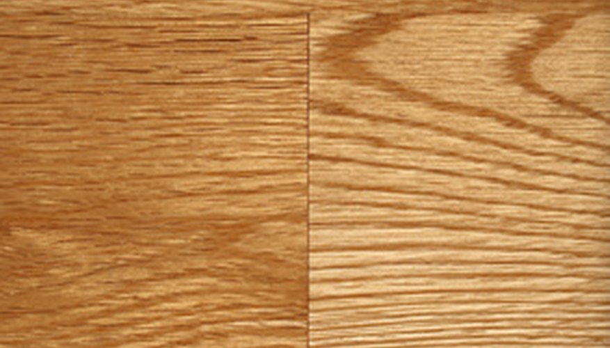 Photo Credit: hardwood floor texture image by GoodMood Photo from <a href='http://www.fotolia.com'>Fotolia.com</a> Glue new wood to old floor.