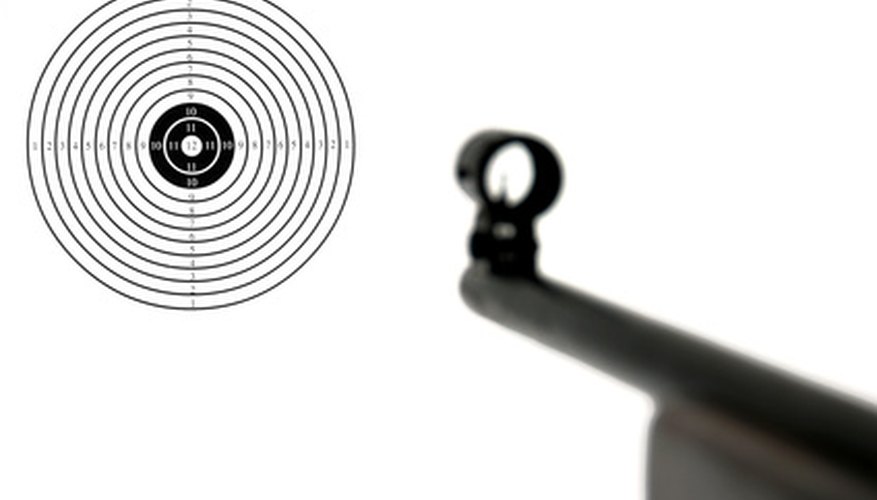 Photo Credit: target image by hans slegers from <a href='http://www.fotolia.com'>Fotolia.com</a> A manufactured target can be attached to the backstop.