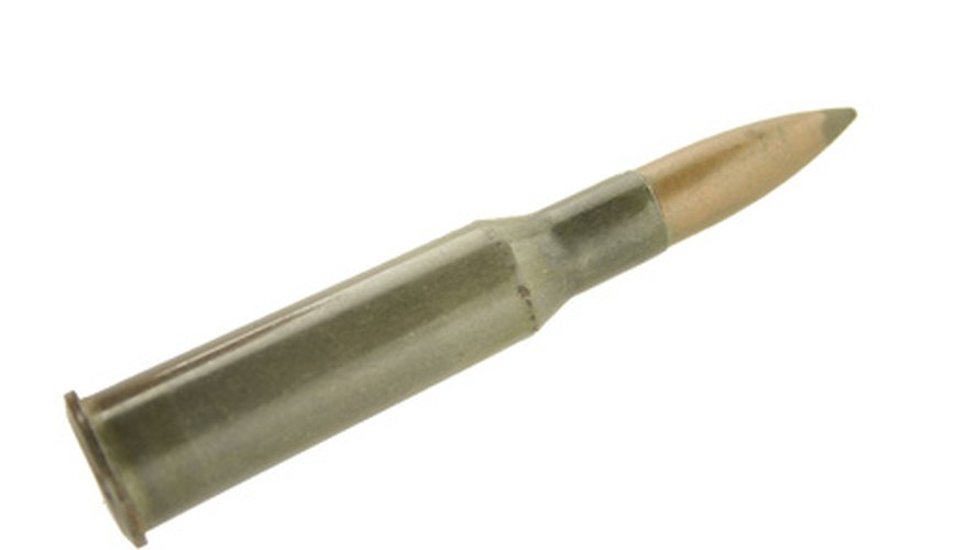 Photo Credit: bullet image by Sean Arenas from <a href='http://www.fotolia.com'>Fotolia.com</a> After adjusting your scope with the target turrets, you should have a very accurate rifle.