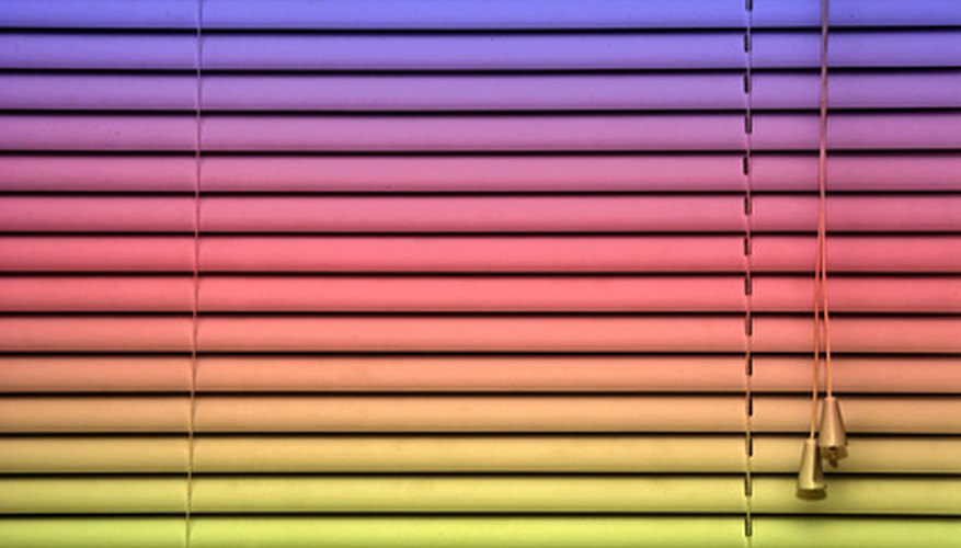 Photo Credit: rainbow blind background image by Stephen Orsillo from <a href='http://www.fotolia.com'>Fotolia.com</a> Mini blinds are a low cost option.