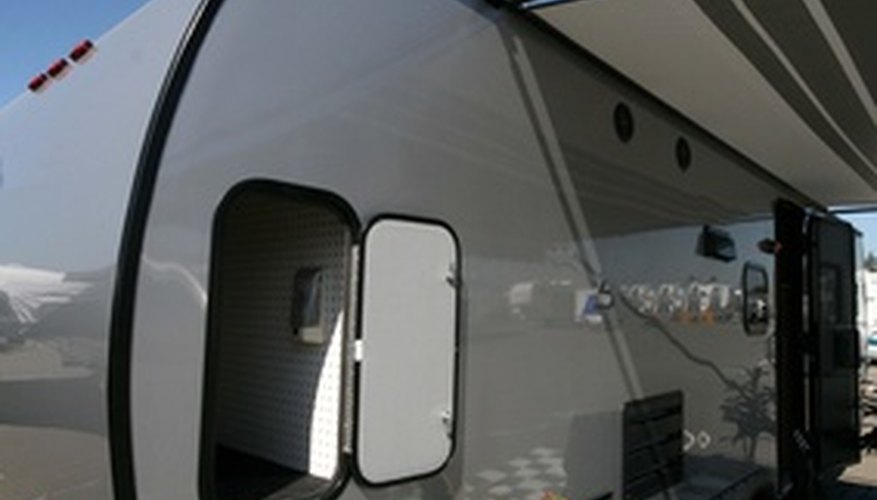 Photo Credit: coach, trailer image by Greg Pickens from <a href='http://www.fotolia.com'>Fotolia.com</a> Vintage trailers may have all the comforts of home, including a kitchen and bathroom.