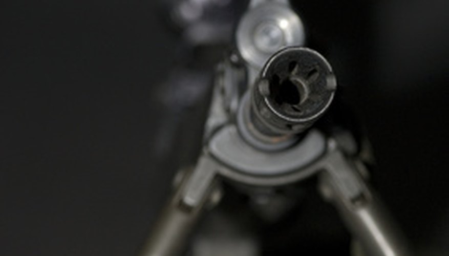 Photo Credit: Main Battle Assault Rifle image by Peter Orsaeo Sr from <a href='http://www.fotolia.com'>Fotolia.com</a> When sighting in the scope, adjust one turret at a time.
