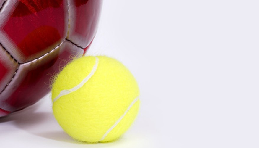 Scottish girls bounced a small ball against the wall.