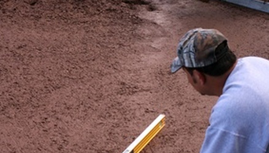 Level the ground and pour a concrete floor.
