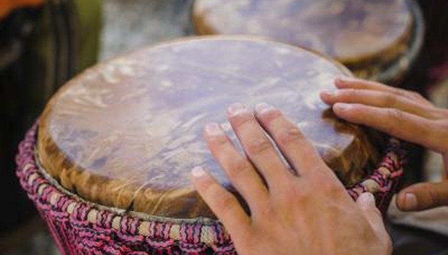 Man playing African drum.